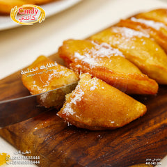 Candy brand candy stuffed frozen Katayef with peanuts, raisins, and coconut, ready-to-cook Middle Eastern vegetarian dessert.