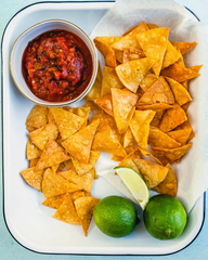 Natural Nachos Tortilla chips along with lemon and salsa