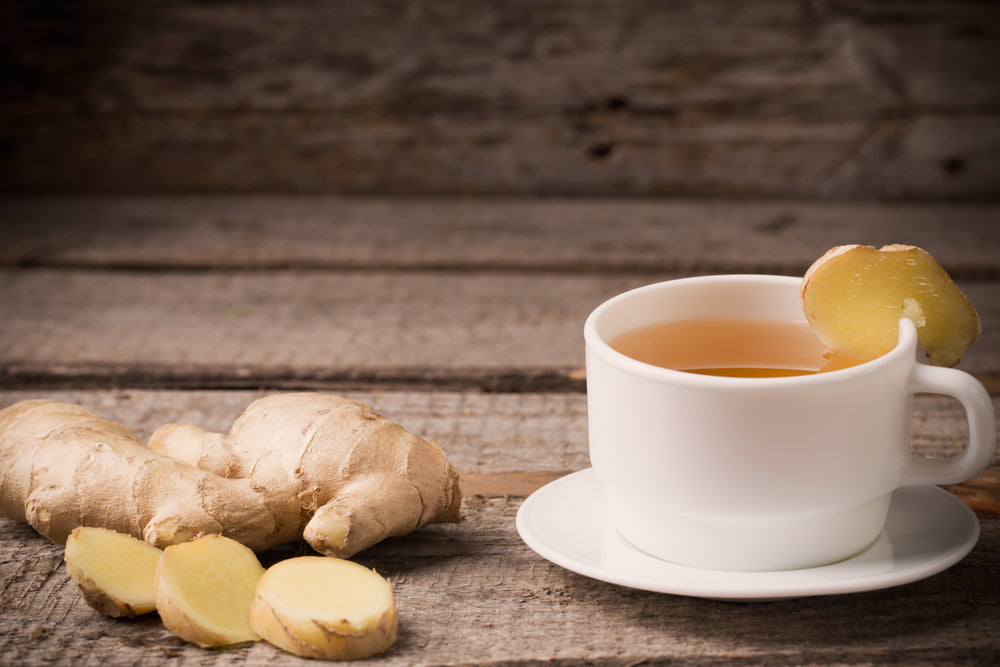 A cup of Alkhair Karak tea along with ginger